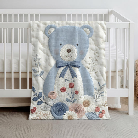 Personalized blue bear blanket with embroidered-look details in soft neutral colors. A cozy newborn blanket and timeless boutique baby gift.