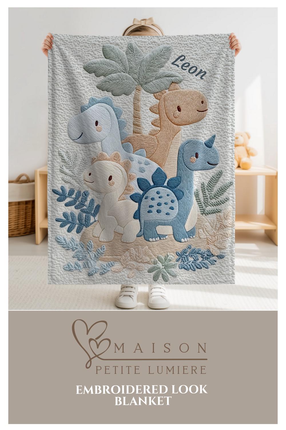 Personalized Dinosaur baby blanket with name - embroidered look details in soft neutral colors. A cozy newborn blanket and timeless boutique baby gift.