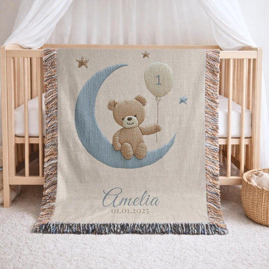 A timeless first birthday keepsake blanket, woven from cotton and personalized with your child’s name and a custom number — made to be gifted and treasured for a lifetime.