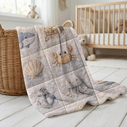 This personalized ocean baby quilt look blanket is custom made with your baby’s name and features a calm patchwork look in beige, sand and blue tones.