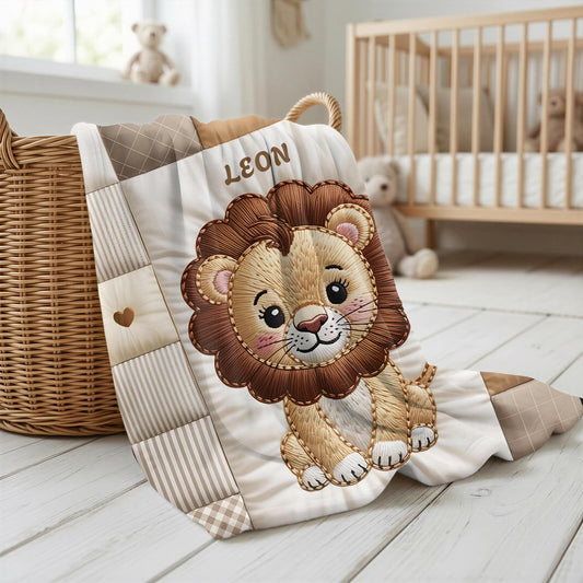A personalized baby quilt blanket featuring a sweet lion in an heirloom-style patchwork look. Soft neutral tones – perfect for safari or neutral nurseries.