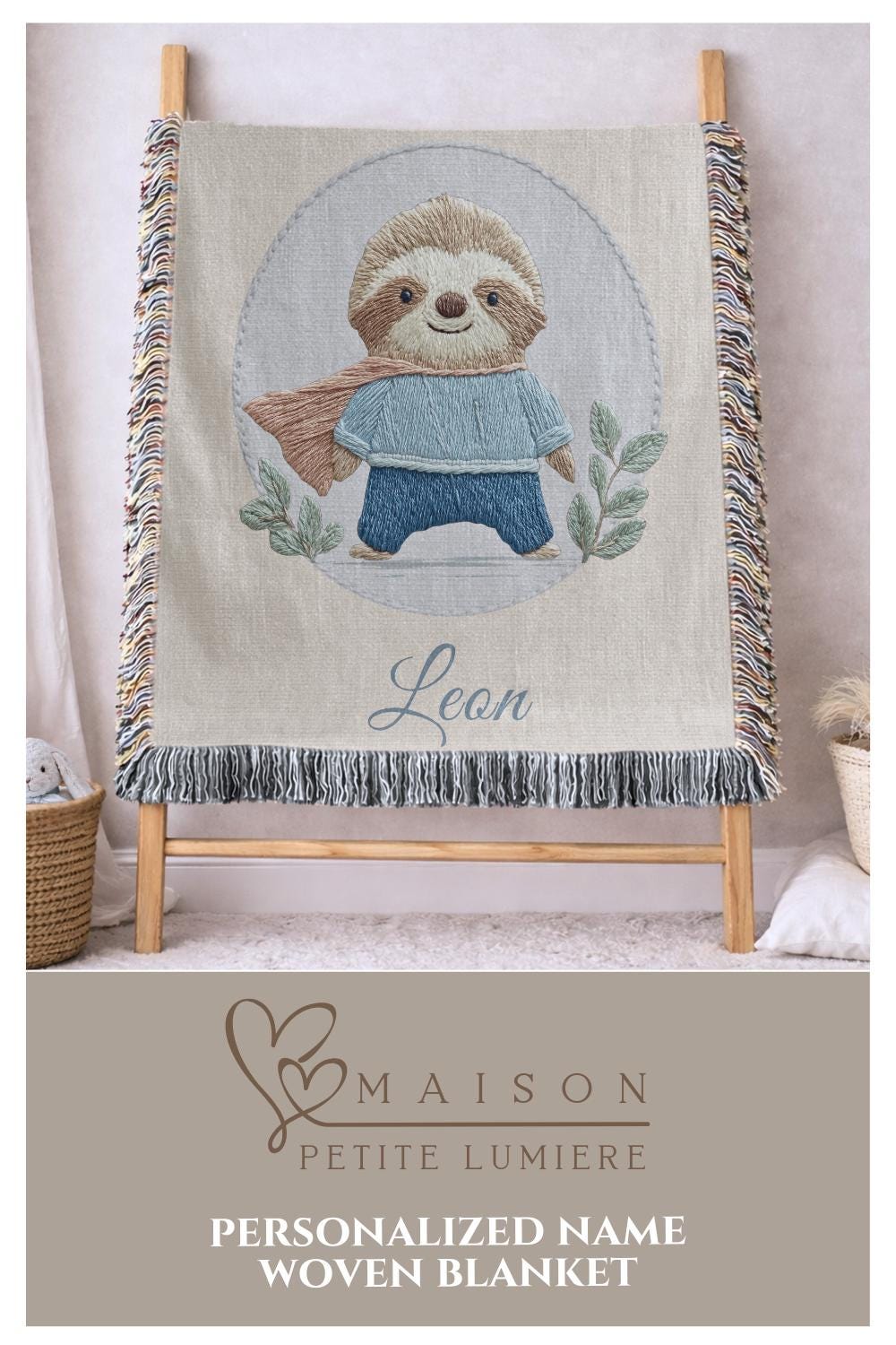 Personalized woven cotton baby blanket featuring a cute superhero sloth. Embroidered-look design, custom name, timeless nursery decor.