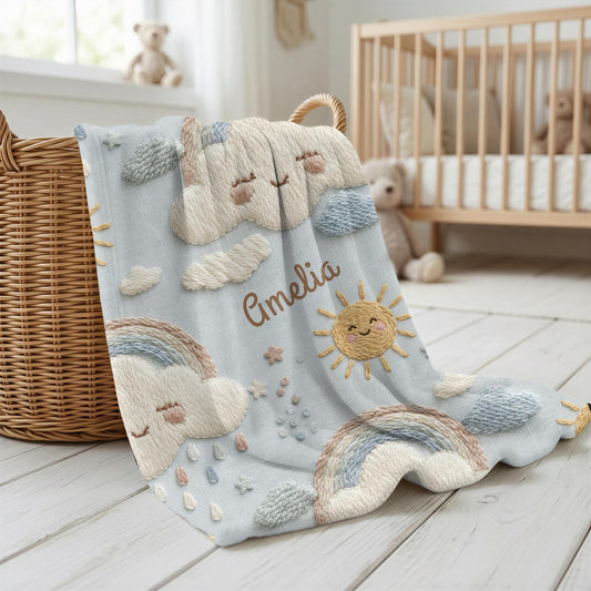Personalized baby blanket in stitched look with dreamy clouds and rainbow. Soft neutral nursery decor and unique baby shower gift.
