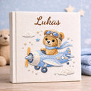 Personalized teddy bear airplane baby memory book with name and birth date. A soft aviation nursery album for first memories and milestones.