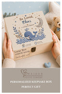 This stunning large wooden keepsake box (30cm / 12 inch) is made for a baby boy destined for great things. A full-color design printed directly onto the handcrafted wood features a chubby blue whale splashing through ocean waves, a sleepy crescent moon, delicate botanical sprigs, and gold and navy stars — all in a beautiful nautical palette of slate navy, cream, and warm gold.
Personalized with baby's name, exact date of birth, and time of birth.