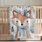 Embroidered-look fox baby blanket with soft floral crown and gentle blue–peach stitched details on a neutral background.