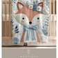 Embroidered-look fox baby blanket with soft floral crown and gentle blue–peach stitched details on a neutral background.