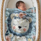 Soft embroidered-look lion baby blanket with pastel florals. Neutral tones, cozy fabric — a boutique newborn gift for calm, modern nursery decor.
