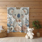 Koala bear baby blanket with embroidered-look floral design in gentle neutral tones. A cozy newborn blanket and timeless baby gift for girls