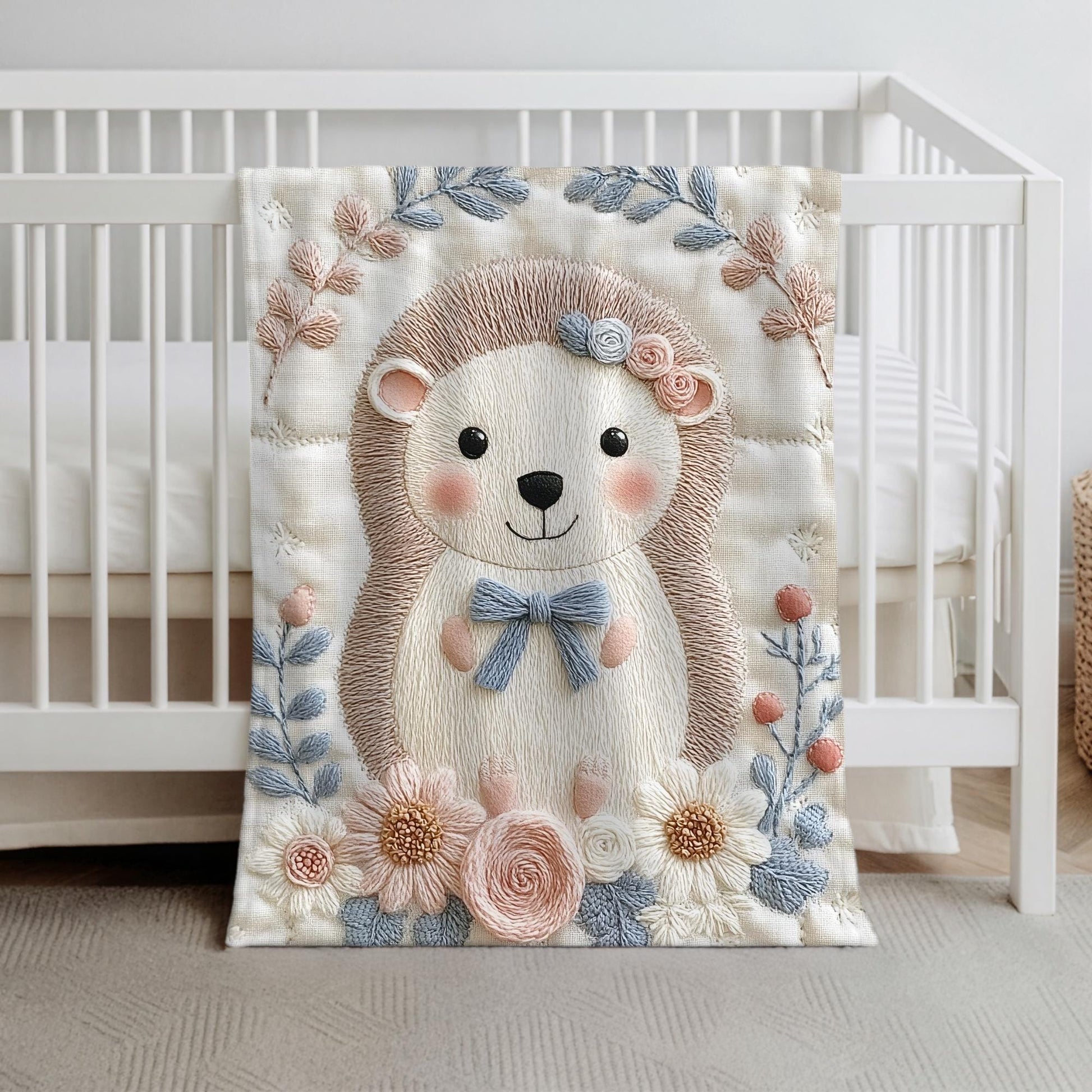 Hedgehog blanket with embroidered-look details in soft neutral colors. A cozy newborn blanket and timeless boutique baby gift.