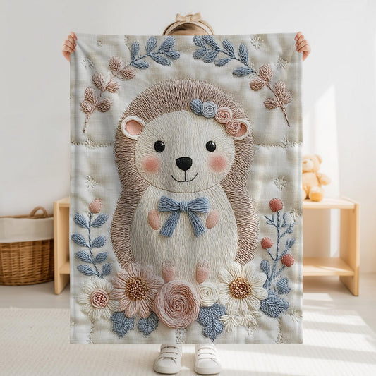 Hedgehog blanket with embroidered-look details in soft neutral colors. A cozy newborn blanket and timeless boutique baby gift.