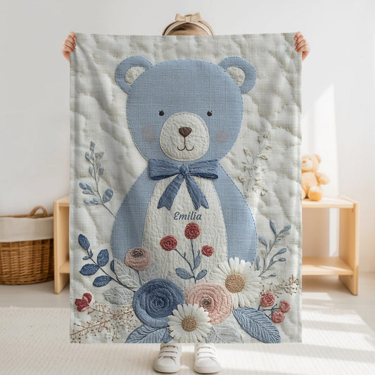 Personalized blue bear blanket with embroidered-look details in soft neutral colors. A cozy newborn blanket and timeless boutique baby gift.