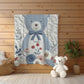 Personalized blue bear blanket with embroidered-look details in soft neutral colors. A cozy newborn blanket and timeless boutique baby gift.