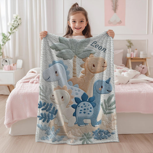 Personalized Dinosaur baby blanket with name - embroidered look details in soft neutral colors. A cozy newborn blanket and timeless boutique baby gift.