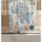 Soft embroidered-look elephant baby blanket with pastel florals. Neutral tones, cozy fabric — a boutique newborn gift for calm, modern nursery decor.