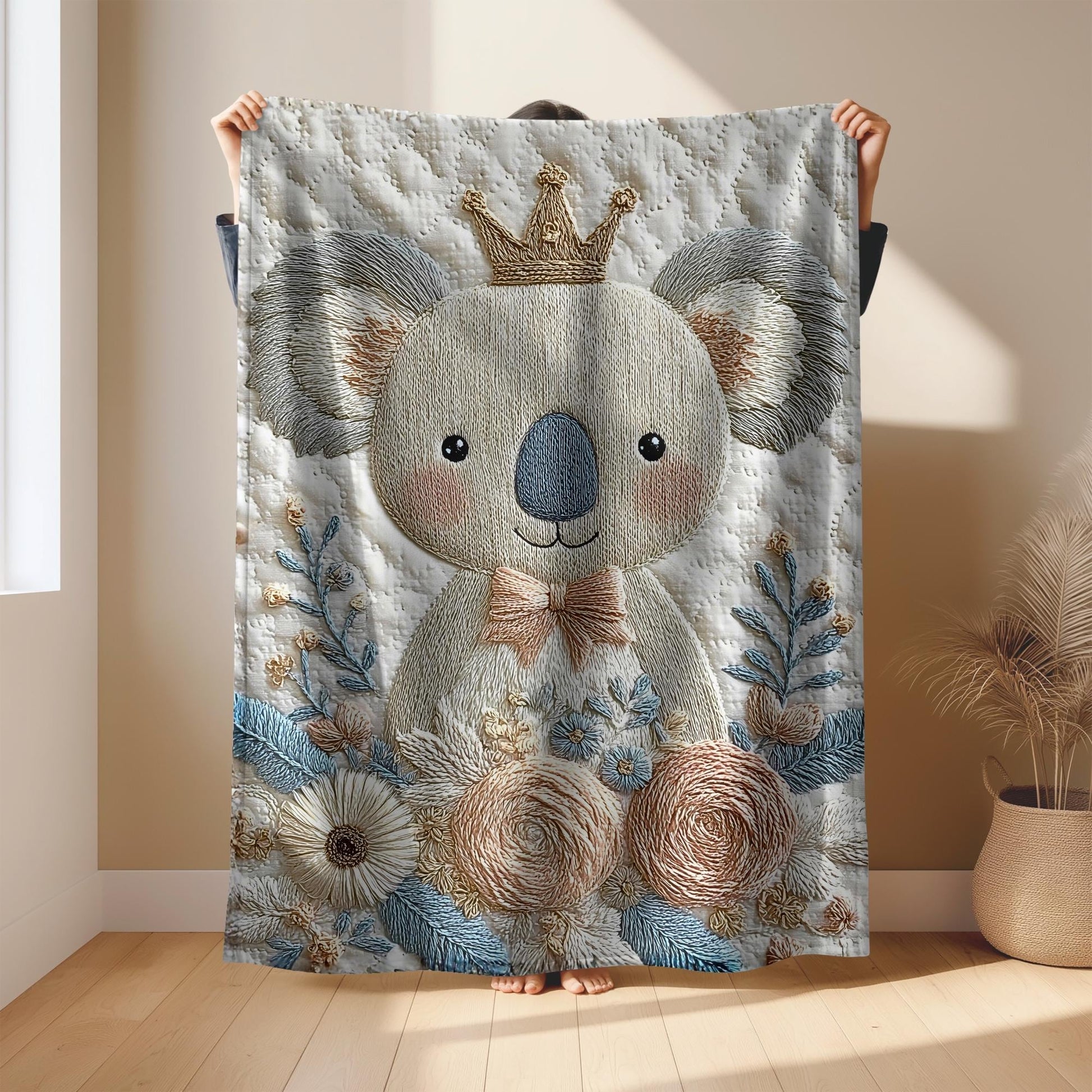Koala bear baby blanket with embroidered-look floral design in gentle neutral tones. A cozy newborn blanket and timeless baby gift for girls