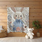 Bunny Baby blanket with embroidered-look details in soft neutral colors. A cozy newborn blanket and timeless boutique baby gift.