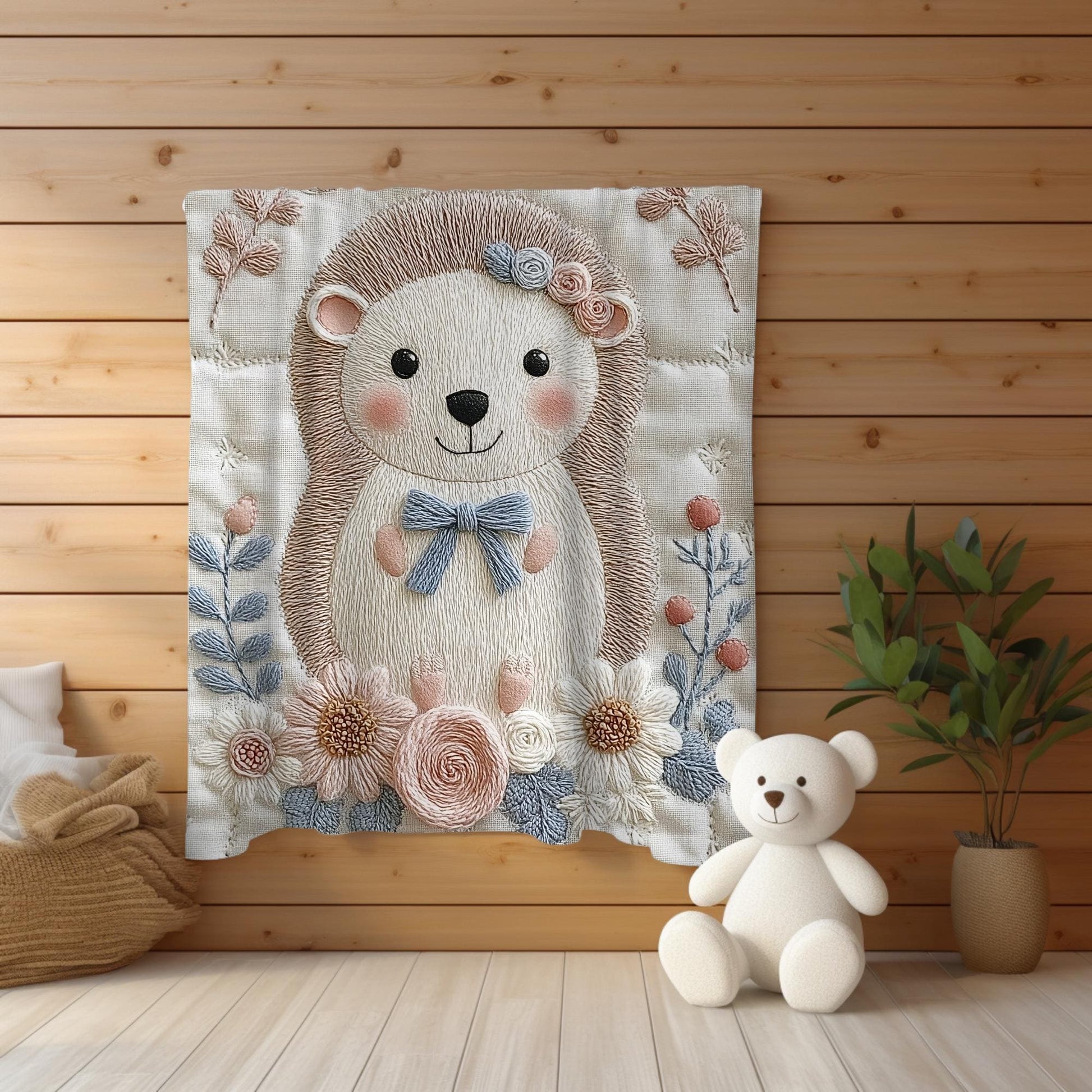 Hedgehog blanket with embroidered-look details in soft neutral colors. A cozy newborn blanket and timeless boutique baby gift.