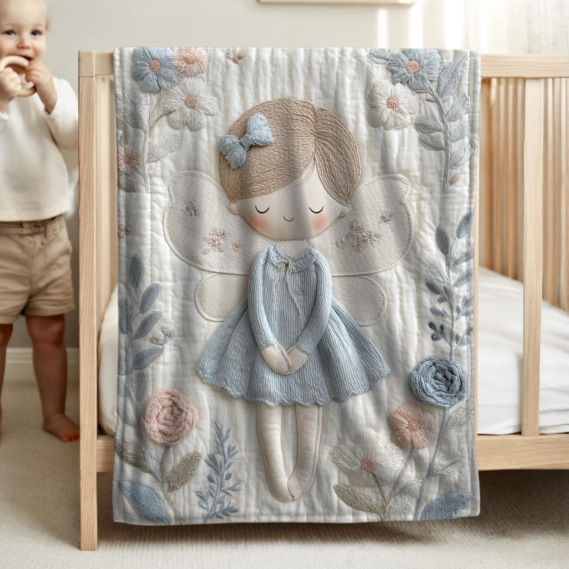 A soft embroidered-look baby blanket featuring a gentle angel fairy design in calm neutral tones. A timeless heirloom piece for modern nurseries, keepsakes and meaningful baby gifts.
