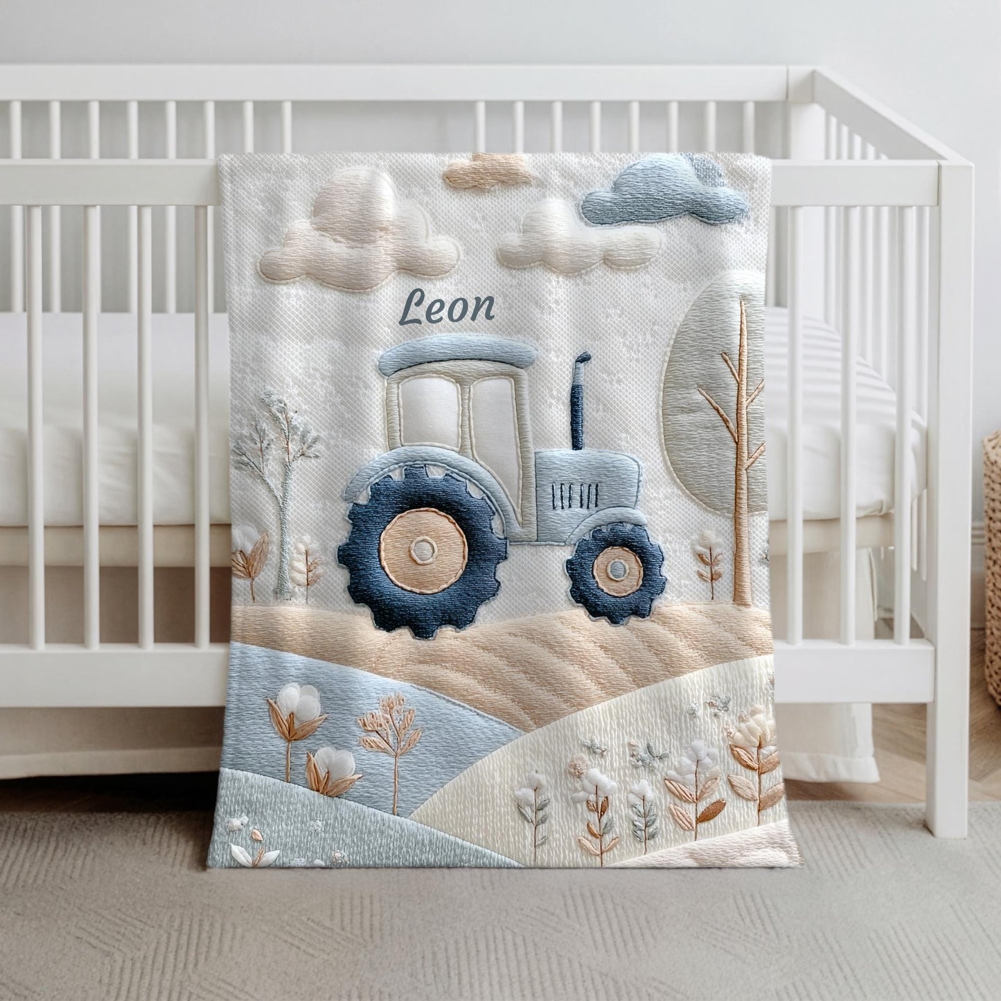 Personalized Traktor baby blanket with name - embroidered look details in soft neutral colors. A cozy newborn blanket and timeless boutique baby gift.
