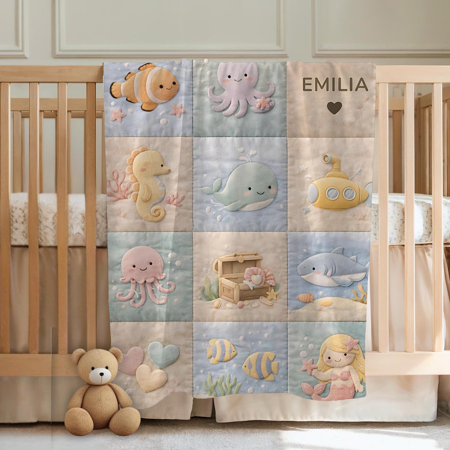 Personalized patchwork look baby blanket with name and sweet underwater motifs like fish, whale, octopus and mermaid in a soft quilt style design.