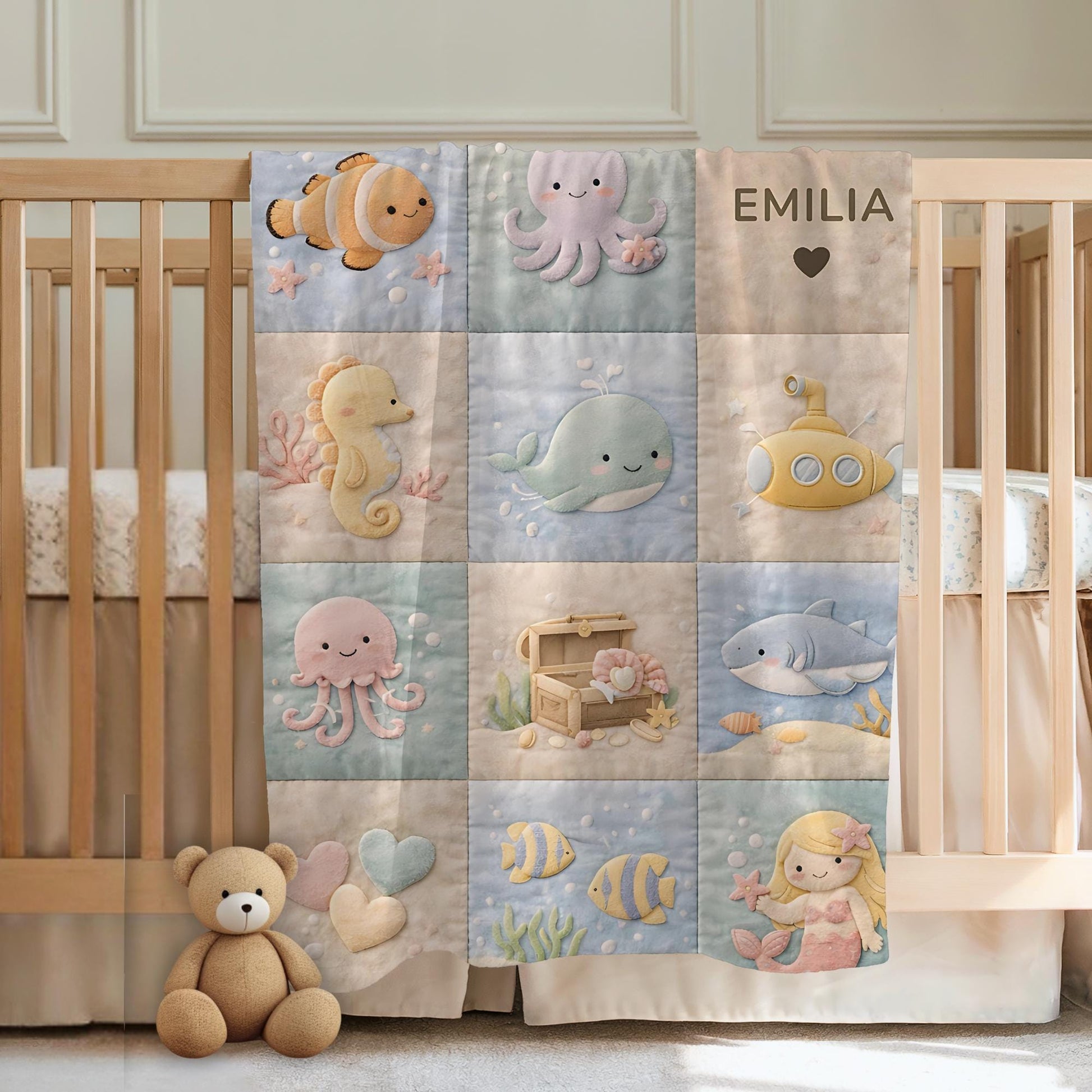 Personalized patchwork look baby blanket with name and sweet underwater motifs like fish, whale, octopus and mermaid in a soft quilt style design.