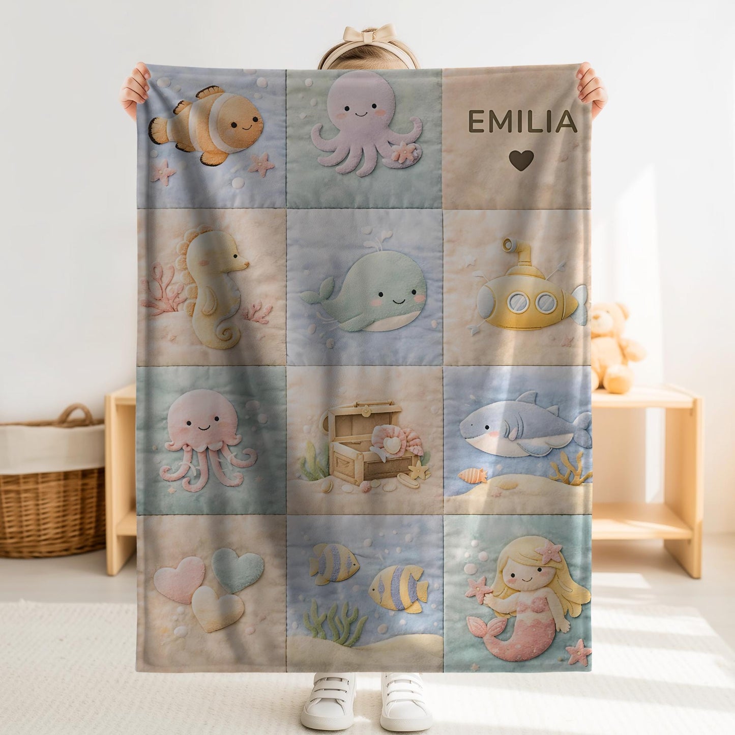 Personalized patchwork look baby blanket with name and sweet underwater motifs like fish, whale, octopus and mermaid in a soft quilt style design.