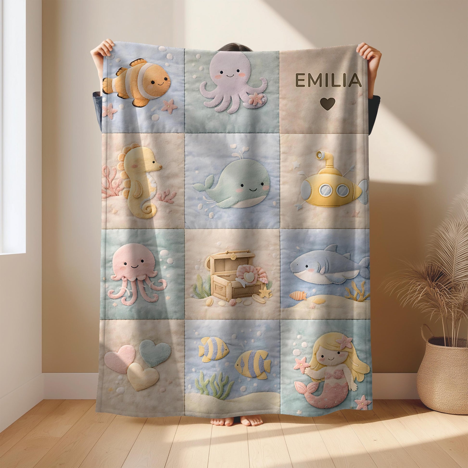 Personalized patchwork look baby blanket with name and sweet underwater motifs like fish, whale, octopus and mermaid in a soft quilt style design.