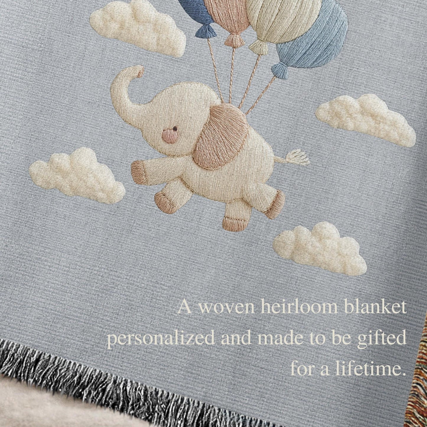 Personalized elephant woven blanket made from 100% cotton. A soft sky-themed nursery design featuring a baby elephant floating with balloons, woven in an embroidered-look finish — custom name and optional birth date included.