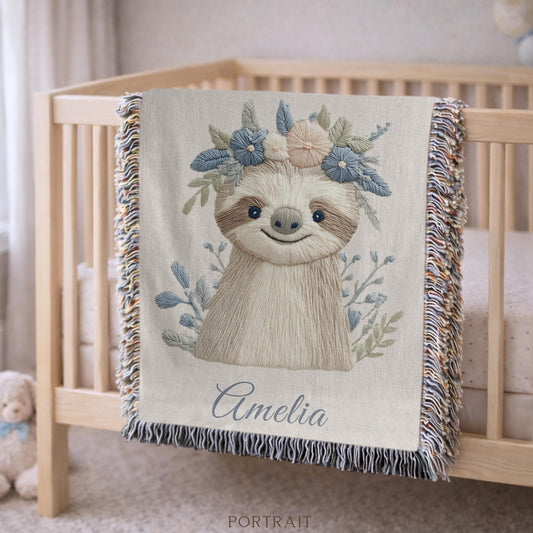 Woven cotton baby blanket with a calm sloth design. Personalized with name, neutral nursery decor and a timeless heirloom newborn gift.
