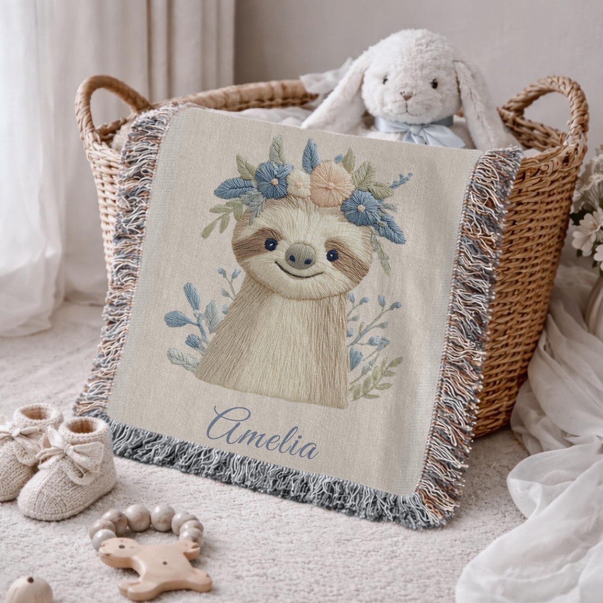 Woven cotton baby blanket with a calm sloth design. Personalized with name, neutral nursery decor and a timeless heirloom newborn gift.
