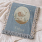 Personalized woven cotton baby blanket featuring a calm elephant under the moon. Embroidered-look design, custom name & birth date — timeless nursery decor.
