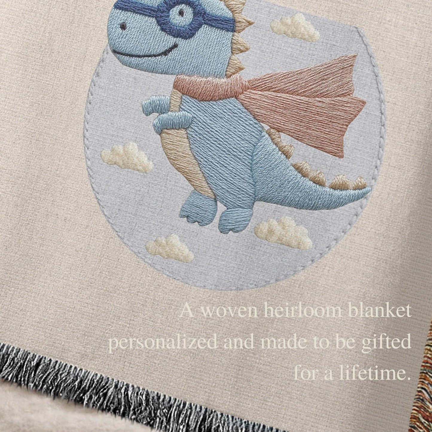Personalized dinosaur woven baby blanket in 100% cotton. Embroidered-look superhero dino design, custom name keepsake for nursery decor.