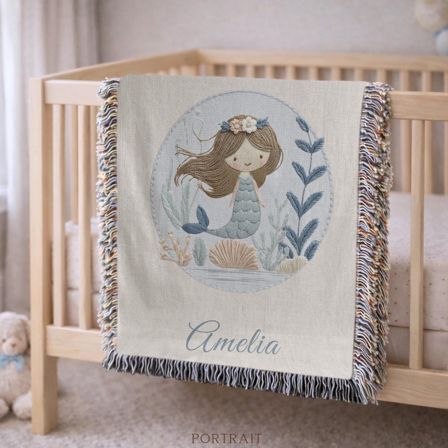 Personalized woven baby blanket featuring a calm mermaid design. Ocean under the sea nursery decor, crafted as a soft cotton tapestry keepsake.