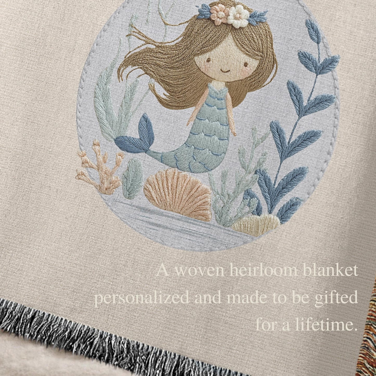 Personalized woven baby blanket featuring a calm mermaid design. Ocean under the sea nursery decor, crafted as a soft cotton tapestry keepsake.