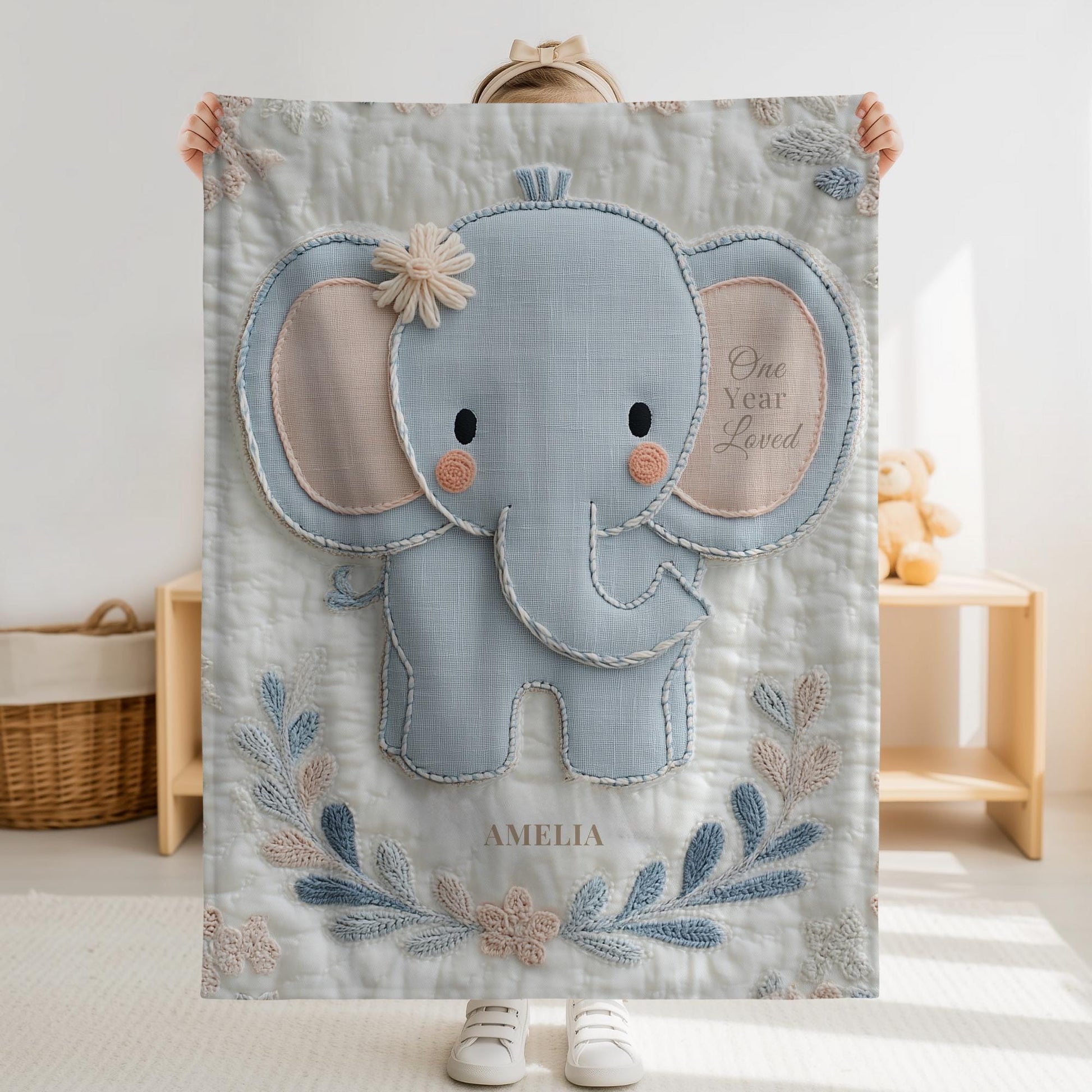Soft embroidered-look baby blanket featuring a calm pastel elephant in a timeless quilted style. Designed to celebrate a baby’s first birthday or to create a meaningful personalized keepsake, this blanket blends gentle nursery aesthetics with a boutique embroidered appearance.