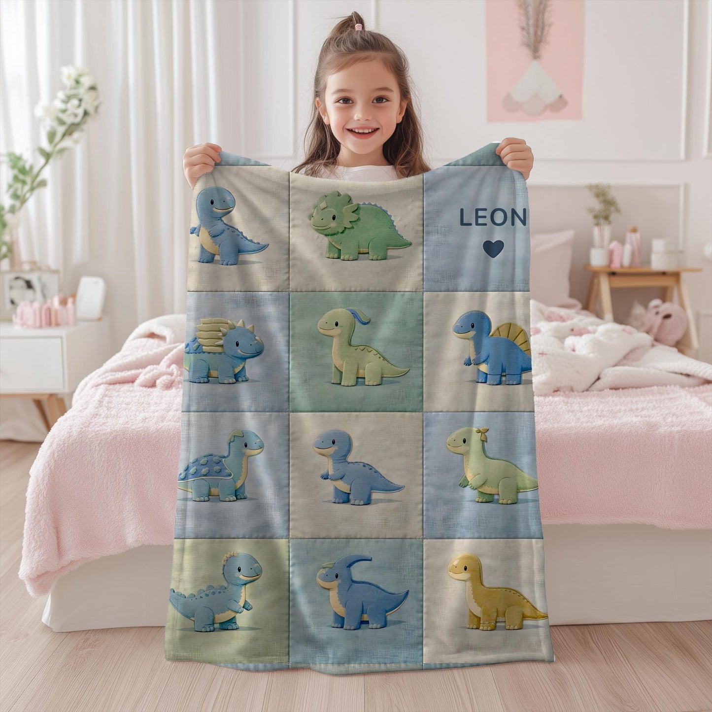 Personalized patchwork look baby blanket with cute dinosaurs in a soft quilt-style design. Neutral nursery colors with custom name panel.