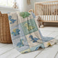 Personalized patchwork look baby blanket with cute dinosaurs in a soft quilt-style design. Neutral nursery colors with custom name panel.