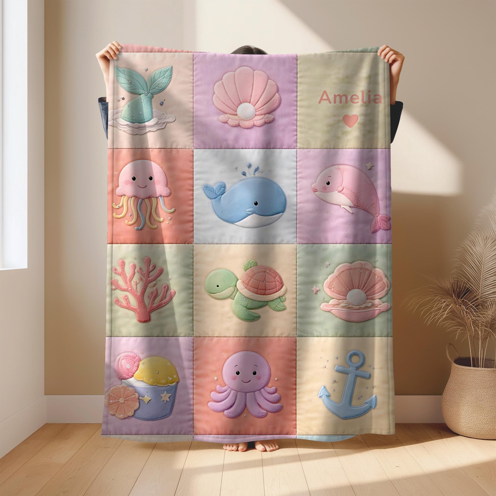 Personalized patchwork look baby blanket with mermaid and ocean animals in a soft quilt-style design. Pastel colors with custom name.
