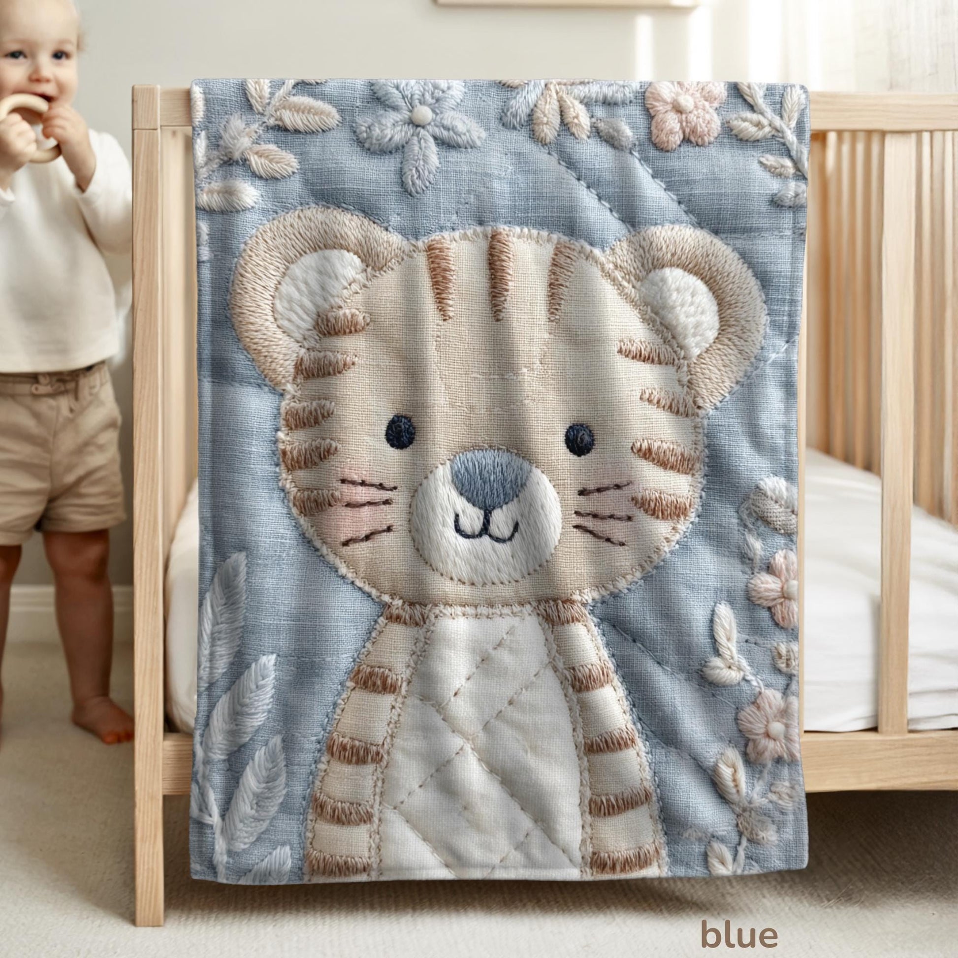 Soft embroidered-look baby blanket featuring a calm tiger motif with delicate floral details. Gentle neutral and pastel tones — a timeless boutique-style gift for modern, serene nurseries.