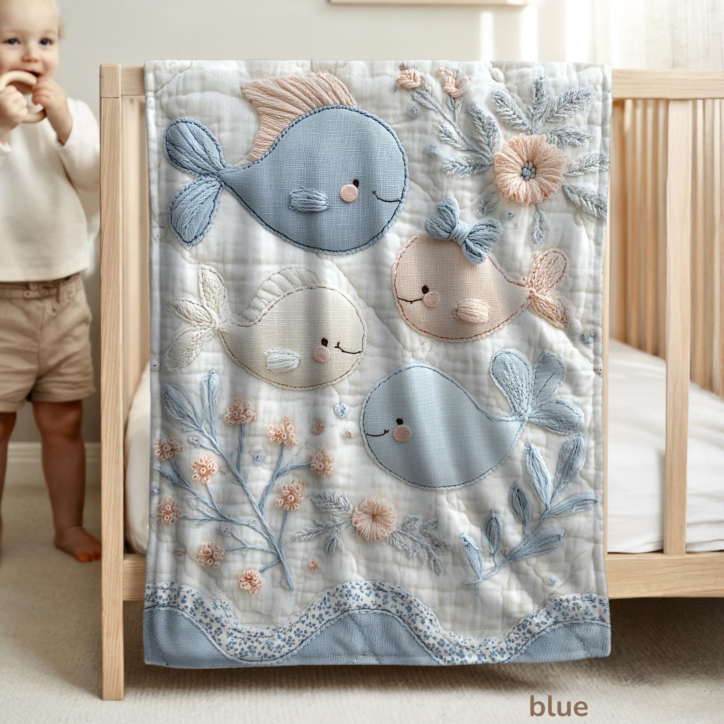 Soft embroidered-look baby blanket featuring a calm fish motif with delicate floral details. Gentle neutral and pastel tones — a timeless boutique-style gift for modern, serene nurseries.