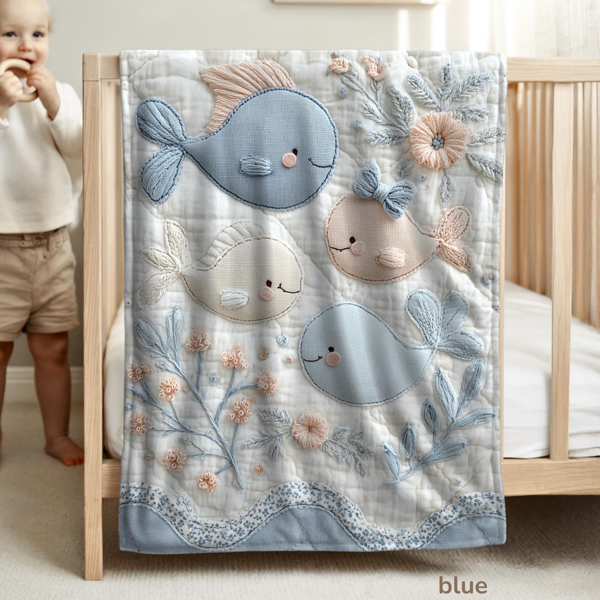Soft embroidered-look baby blanket featuring a calm fish motif with delicate floral details. Gentle neutral and pastel tones — a timeless boutique-style gift for modern, serene nurseries.