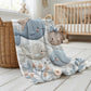 Soft embroidered-look baby blanket featuring a calm fish motif with delicate floral details. Gentle neutral and pastel tones — a timeless boutique-style gift for modern, serene nurseries.