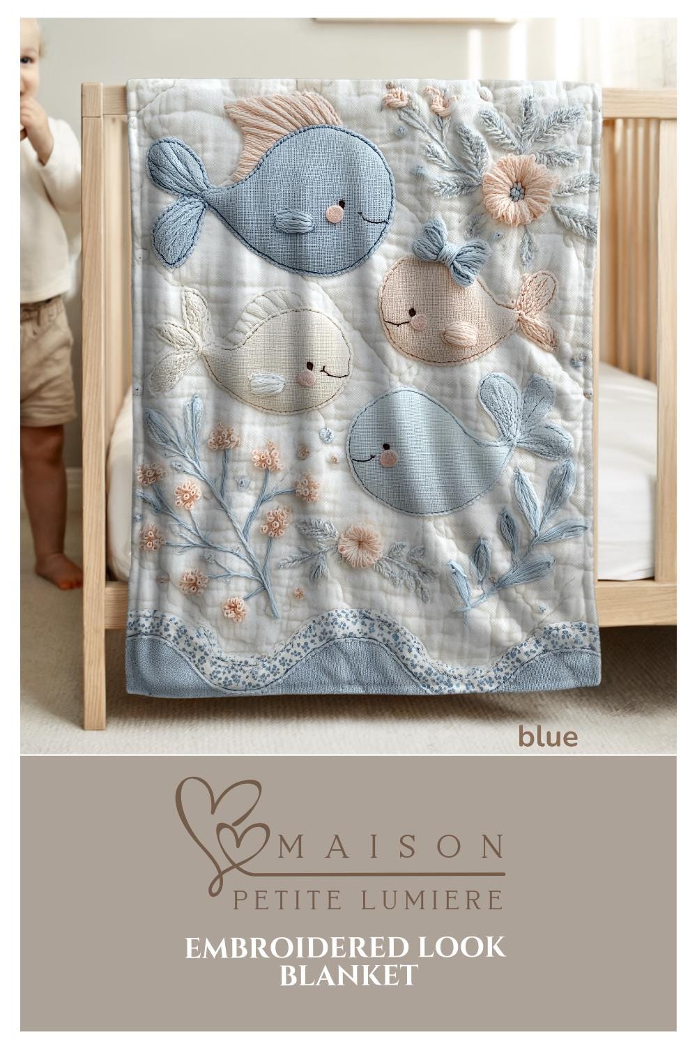 Soft embroidered-look baby blanket featuring a calm fish motif with delicate floral details. Gentle neutral and pastel tones — a timeless boutique-style gift for modern, serene nurseries.