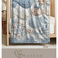 Soft embroidered-look baby blanket featuring a calm fish motif with delicate floral details. Gentle neutral and pastel tones — a timeless boutique-style gift for modern, serene nurseries.