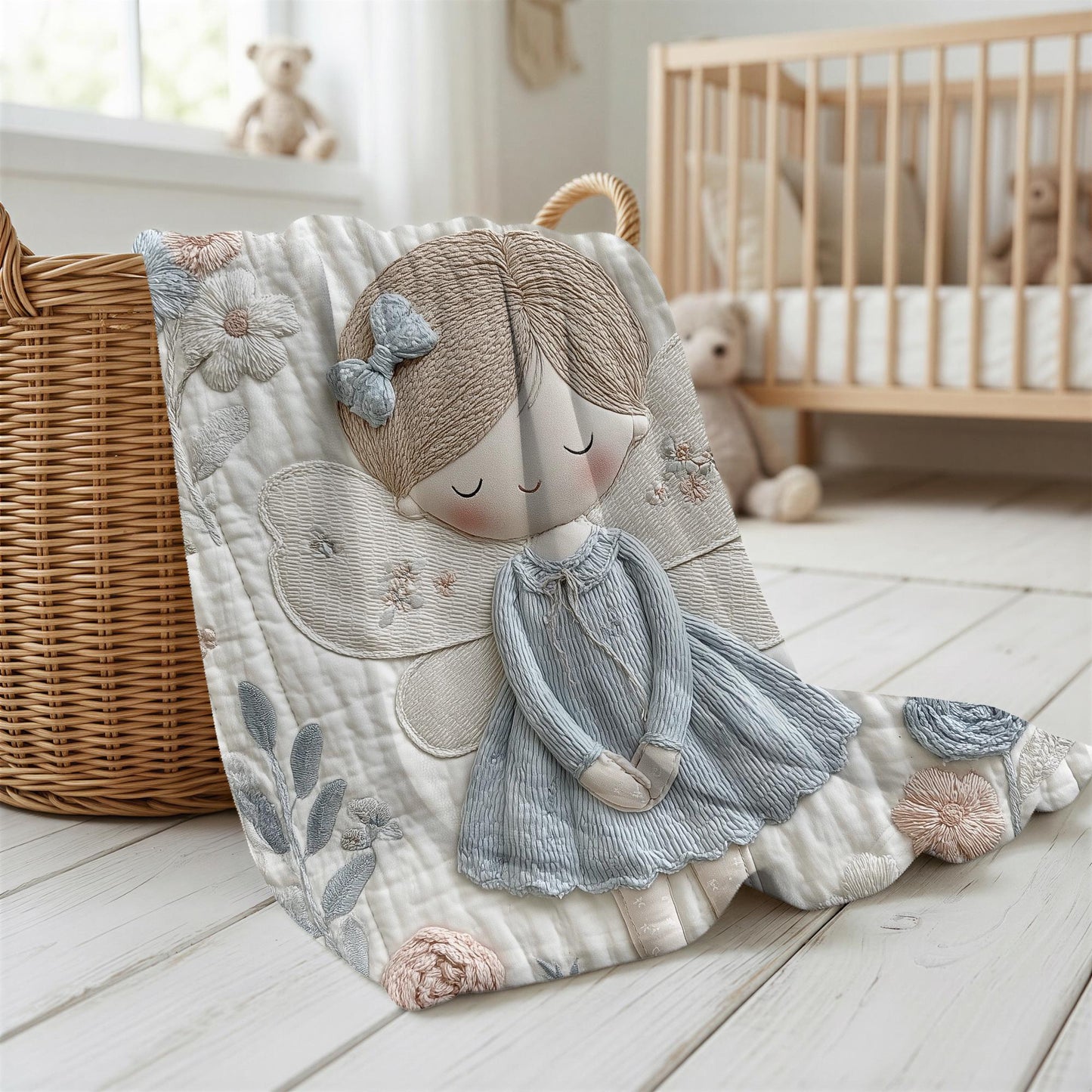 A soft embroidered-look baby blanket featuring a gentle angel fairy design in calm neutral tones. A timeless heirloom piece for modern nurseries, keepsakes and meaningful baby gifts.