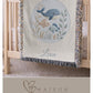 This personalized woven baby blanket features a gentle ocean theme with a sweet whale and fish design in a soft embroidered-look style.
