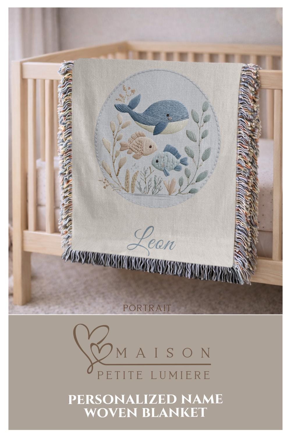 This personalized woven baby blanket features a gentle ocean theme with a sweet whale and fish design in a soft embroidered-look style.