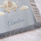 Personalized elephant woven blanket made from 100% cotton. A soft sky-themed nursery design featuring a baby elephant floating with balloons, woven in an embroidered-look finish — custom name and optional birth date included.