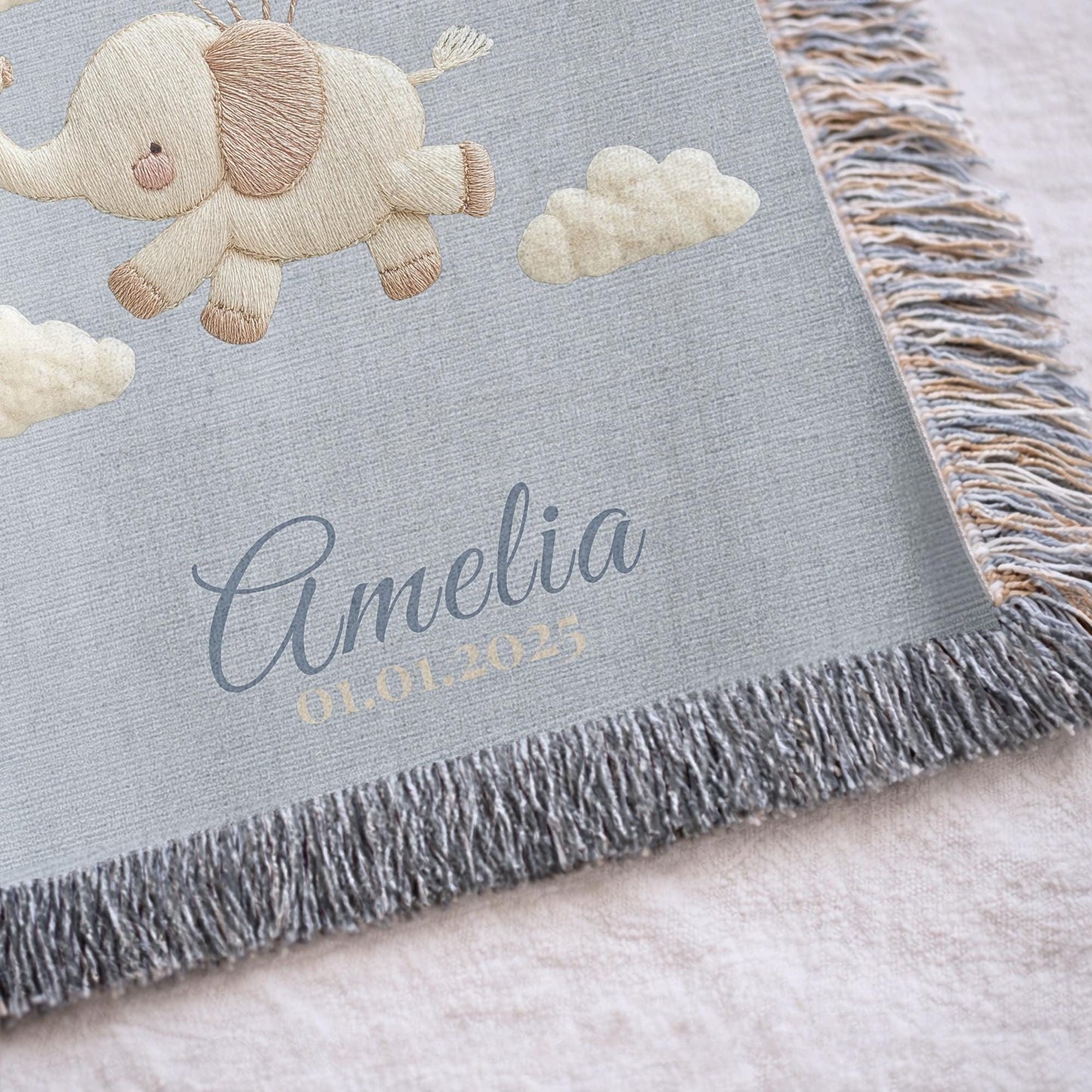 Personalized elephant woven blanket made from 100% cotton. A soft sky-themed nursery design featuring a baby elephant floating with balloons, woven in an embroidered-look finish — custom name and optional birth date included.